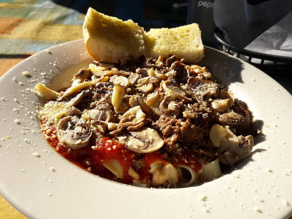 Ravioli with Italian Meat Sauce and Mushrooms